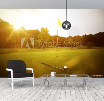 Picture of Golfplatz im Abendrot mit Loch und Golfball und Fahne